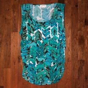 Aqua, black and white top.